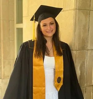 Female wearing Black and gold graduation gown